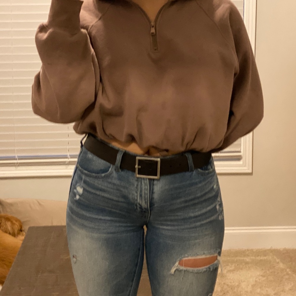 Black leather belt with silver buckle